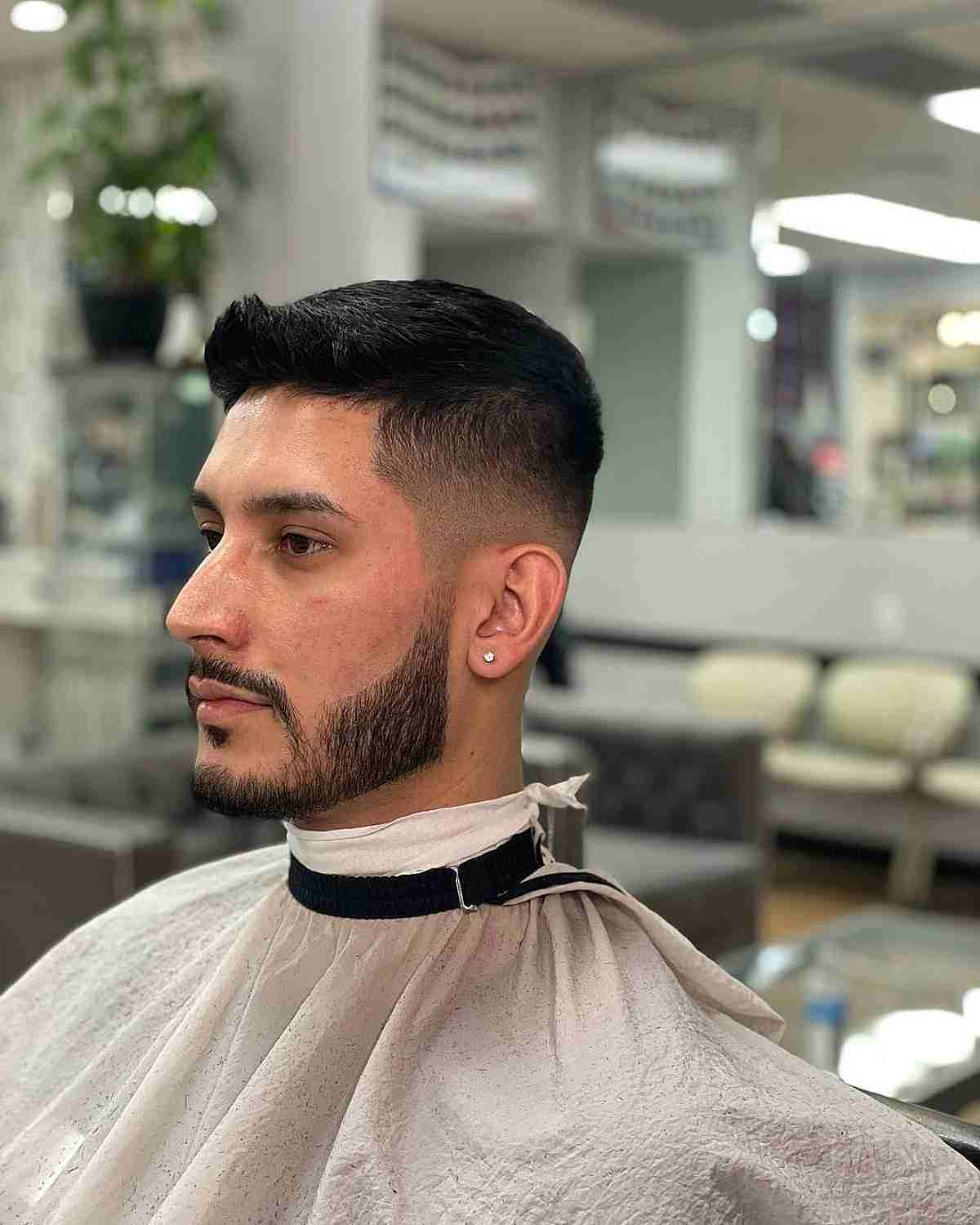 A sharp men's haircut featuring a high-contrast skin fade and quiff.