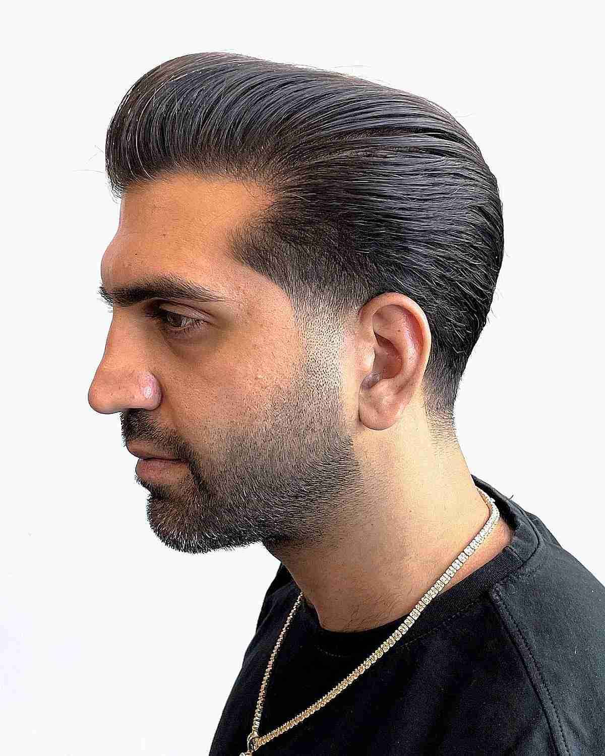 A formal, high-shine slicked back quiff for men.