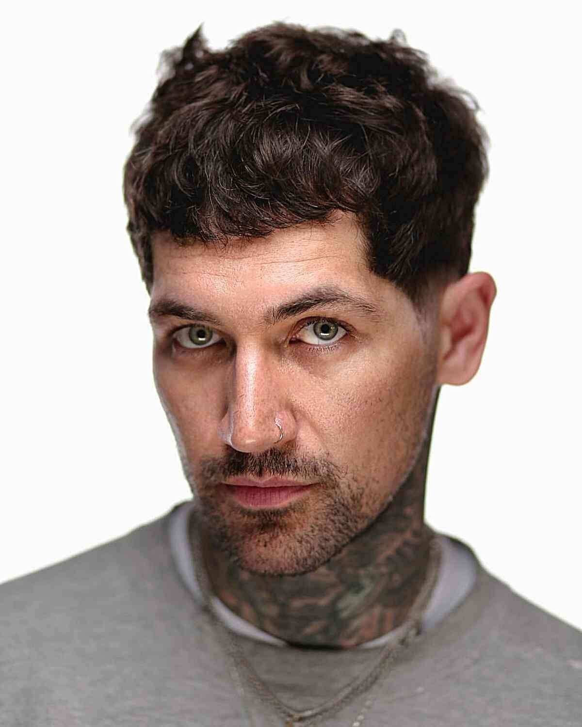 A relaxed, tousled messy quiff hairstyle with natural volume.