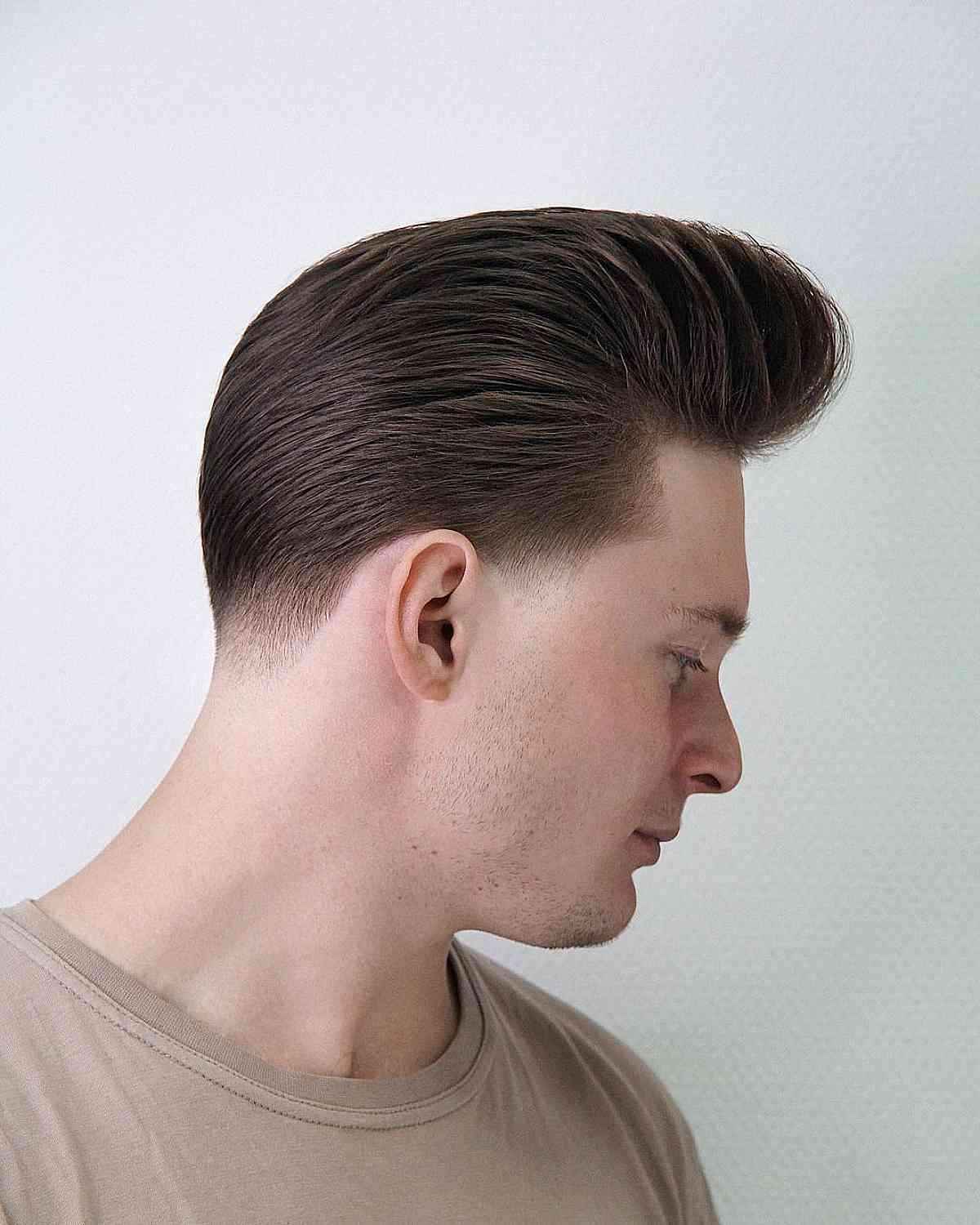 A hybrid pompadour-quiff hairstyle with classic height and structure.
