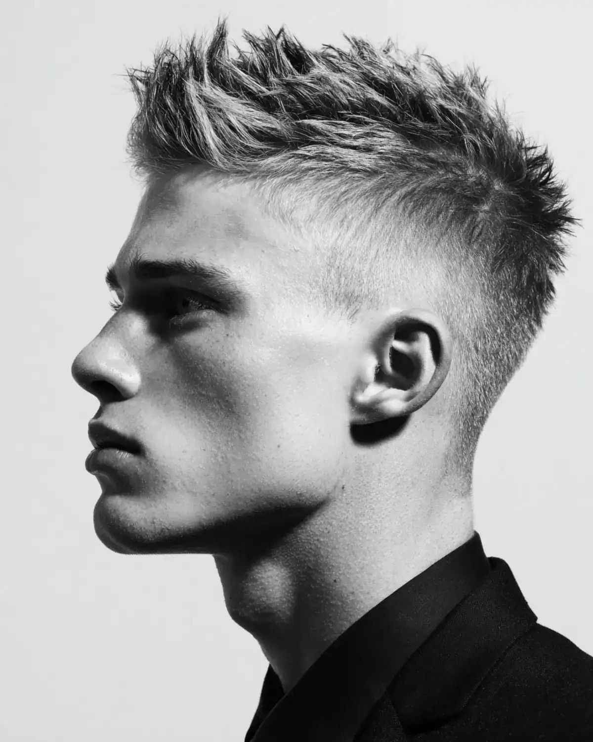 A youthful spiky quiff hairstyle with textured crown spikes.