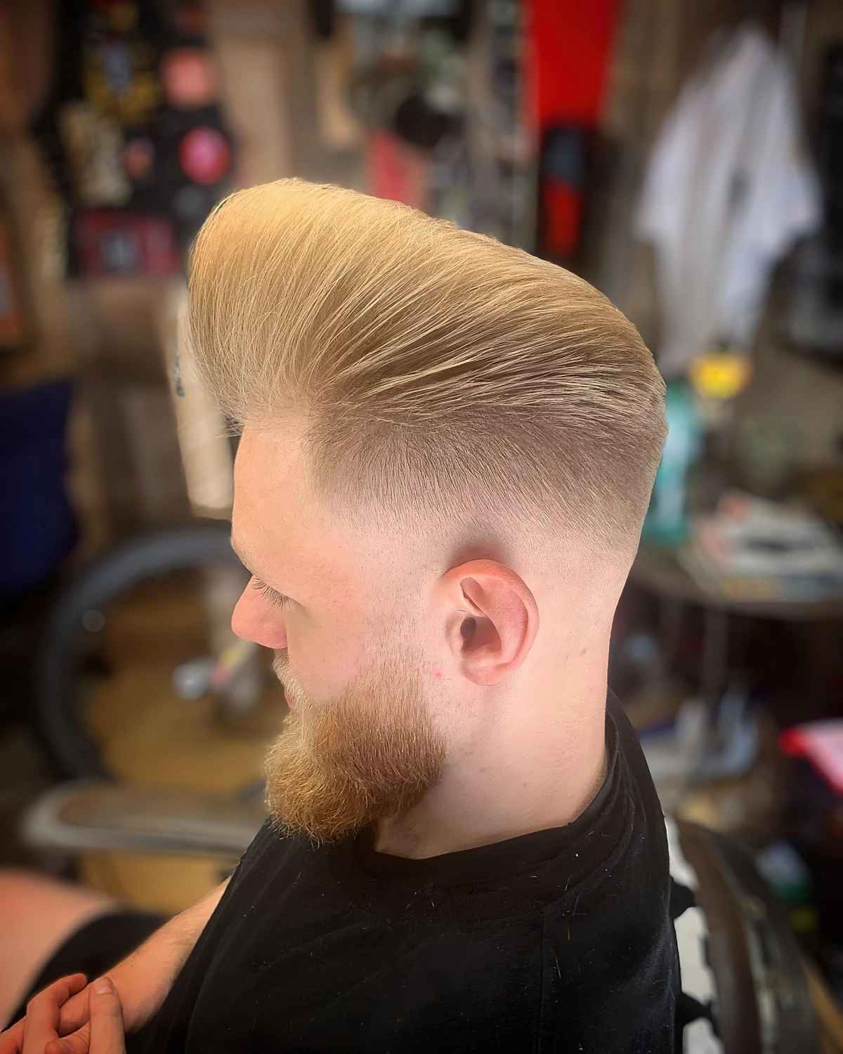 A bold, eye-catching bleached blonde quiff hairstyle.