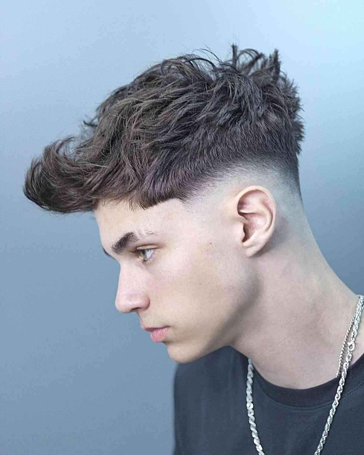 A natural wavy quiff hairstyle for men with textured hair.