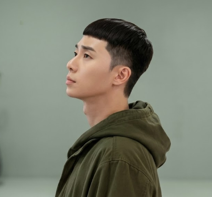 Korean Caesar cut with short even-length top, straight micro fringe, and clean fade sides for masculine definition