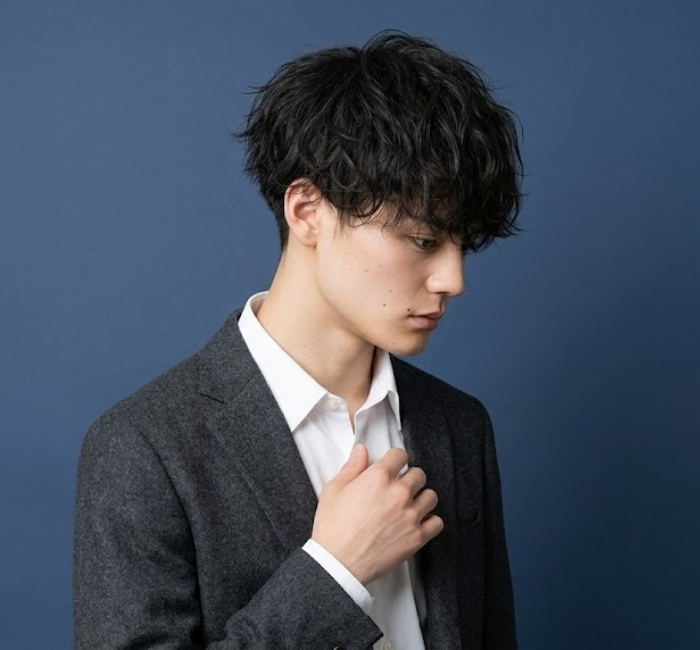Korean messy haircut with soft tousled layers, natural lift, and undone casual styling for effortless appearance