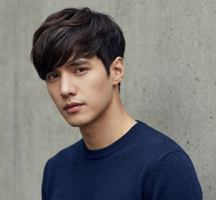 Korean dandy cut with smooth layers, soft side fringe, and classy polished styling for sophisticated men