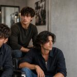 Layered haircuts for men showing various styles including short, medium, and long layers with natural texture and movement